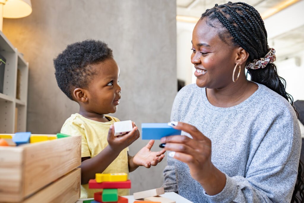child plays with colorful didactic educational toys