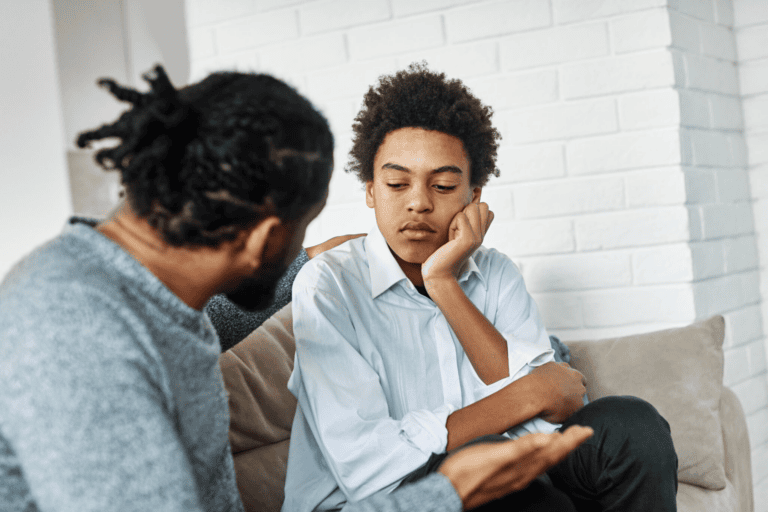 dad having a talk with his son